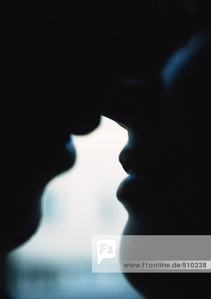 Couple kissing  silhouette  close-up