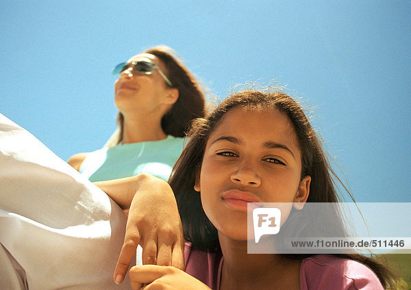 Portrait of girl and mother  low angle view