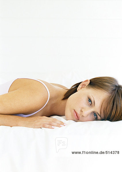 Woman lying on stomach  portrait  close-up