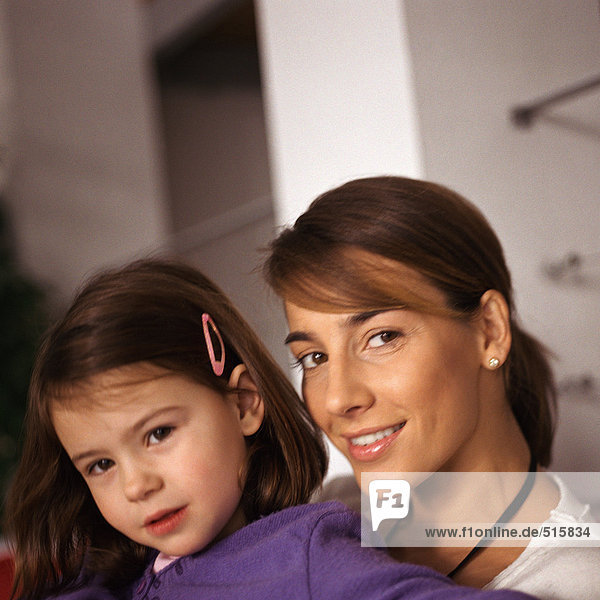 Woman with young girl  portrait  close-up
