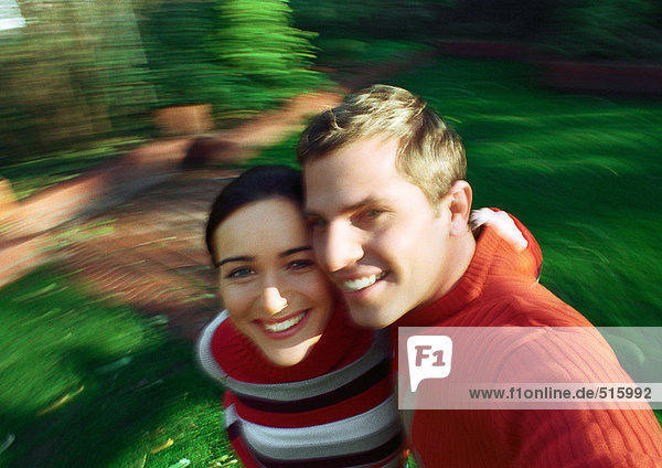 Couple smiling  cheek to cheek  blurred