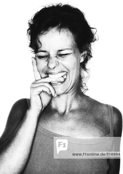 Woman biting her finger  portrait  b&w.
