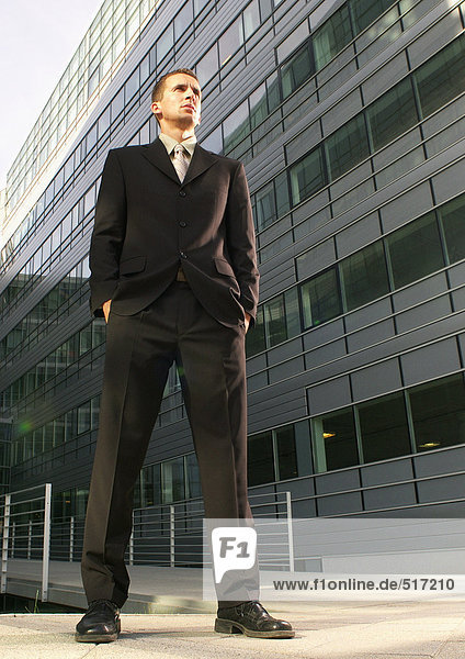 Businessman  building in background  low angle view
