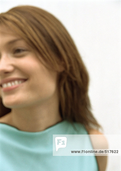 Woman smiling looking away  portrait  blurred