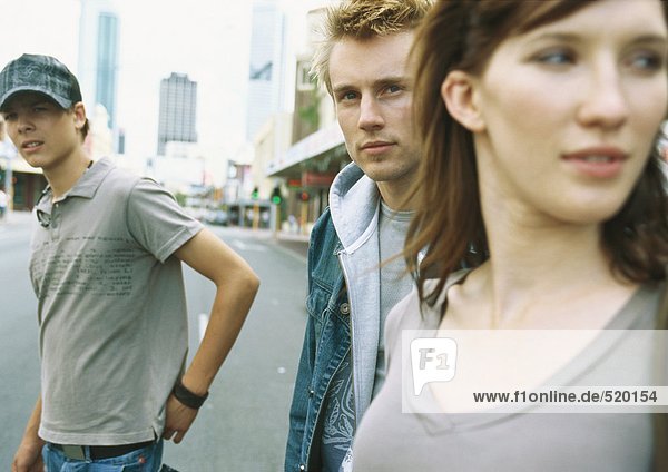 Young people standing in street