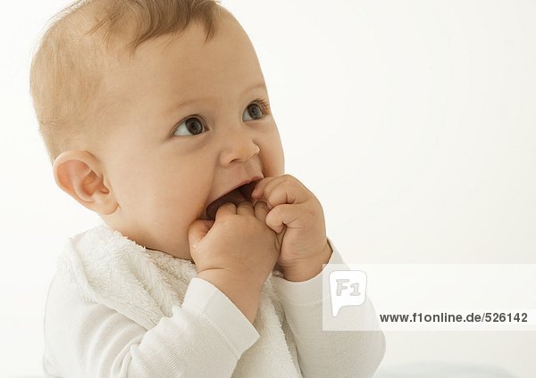Baby with hands in mouth