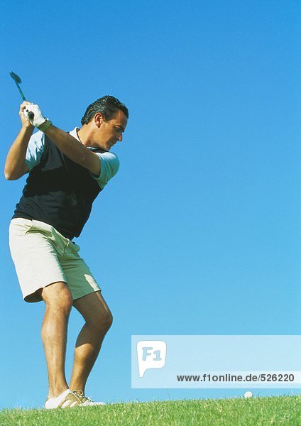 Golfer swinging