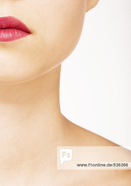 Woman wearing lipstick  view of lower face and neck mouth