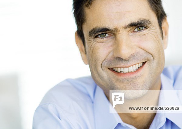 Businessman smiling  close-up