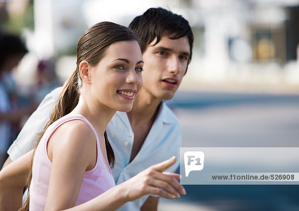 Young couple  woman pointing