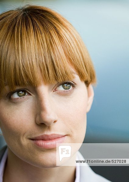 Woman with bangs looking up  portrait