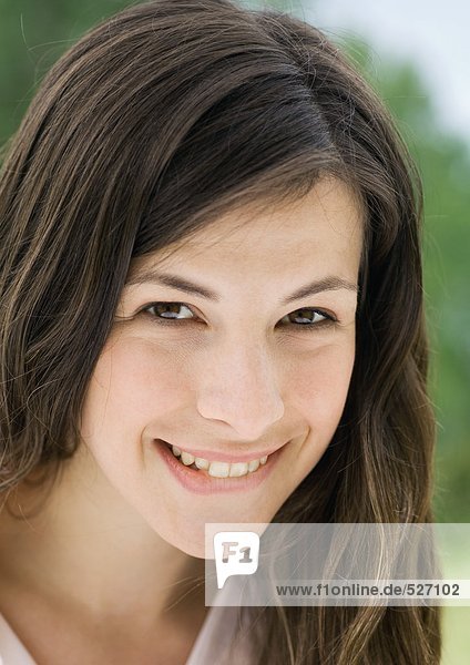 Young woman biting lip  portrait mouth
