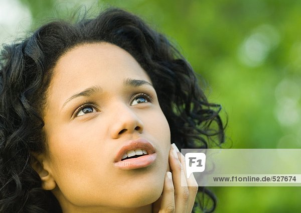 Woman looking up with mouth open