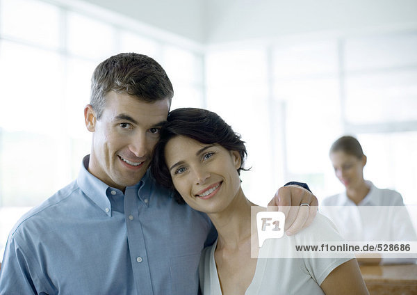 Couple standing in front of reception desk