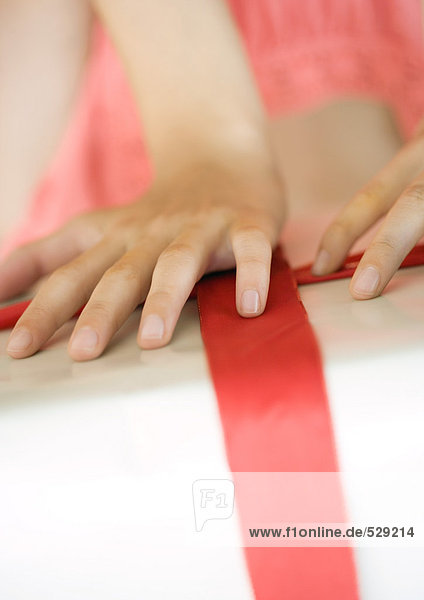 Girl's hands on present