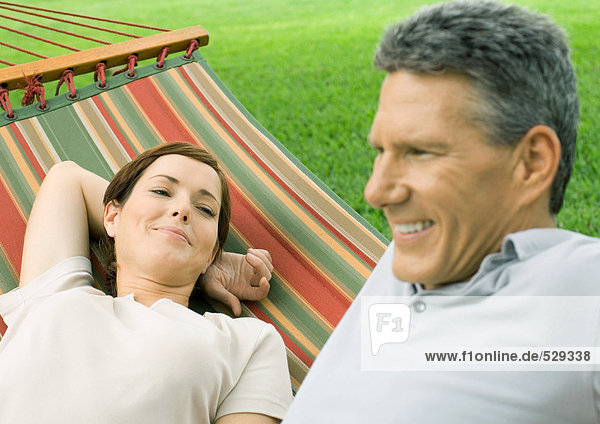 Couple lounging in hammock