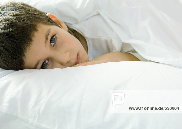 Child lying in bed