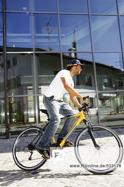 man riding bicycle  side view