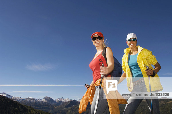 Two women in mountains  Nordic walking