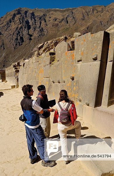 Tourists watching old ruins  Ollantaytambo  Urubamba Province  Cusco Region  Peru