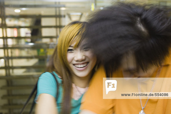 Young couple laughing  blurred motion