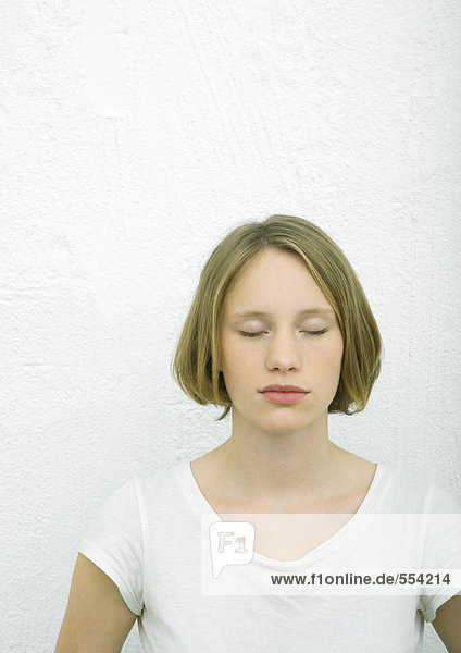 Teenage girl with eyes closed  portrait