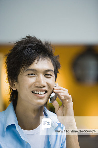 Young man using cell phone