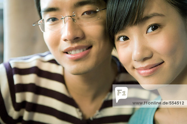 Young couple  smiling at camera  portrait