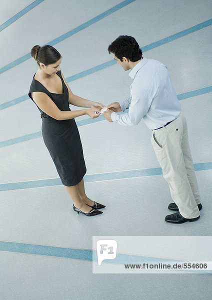 Business associates exchanging business cards