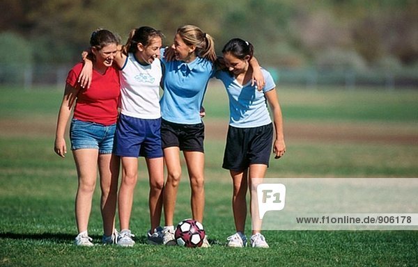 Teen girls with soccer ball