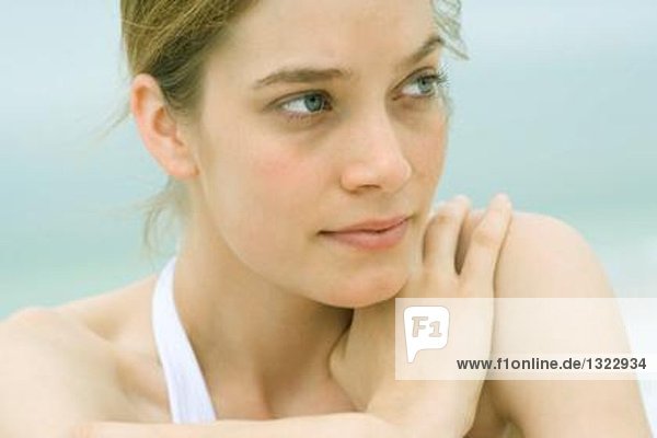 Young woman  head and shoulders  portrait  sea in background