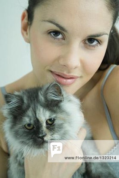 Young woman holding cat  portrait
