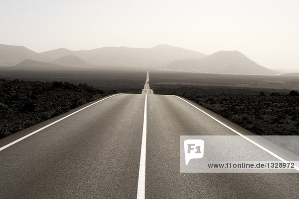 Spain  Lanzarote  empty road through landscape