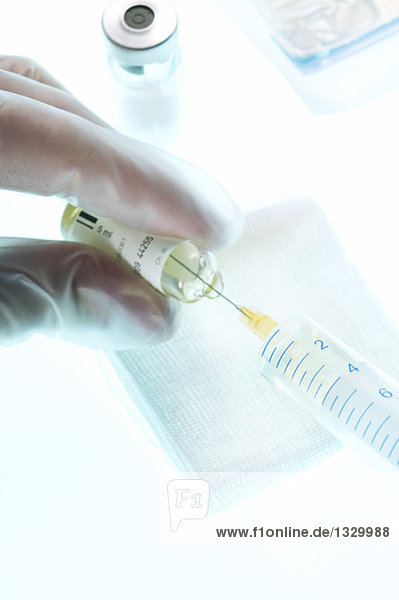 Medicine is drawn into a syringe  close-up