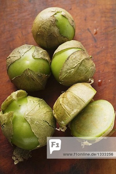 Several tomatillos  one cut open