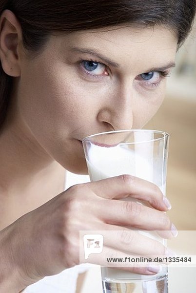 Woman drinking milk out of a glass