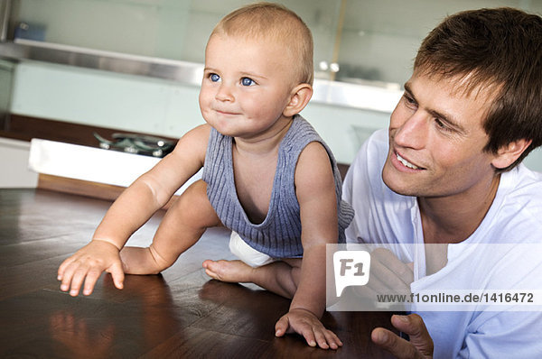 Father and son in kitchen  indoors