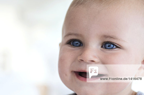 Portrait of a baby smiling  indoors