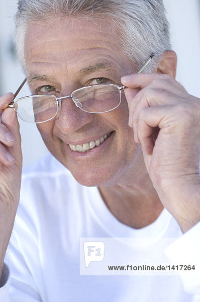 Portrait of smiling man with eyeglasses