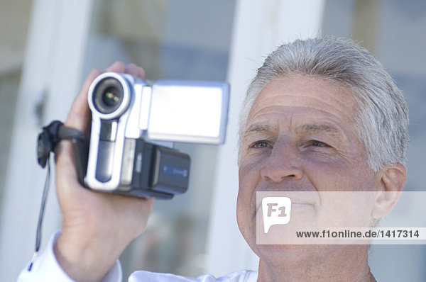 Man using camcorder