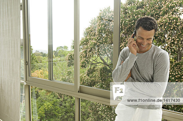 Man phoning  indoors