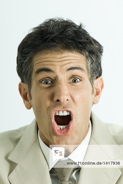 Man screaming  looking at camera  head and shoulders  portrait