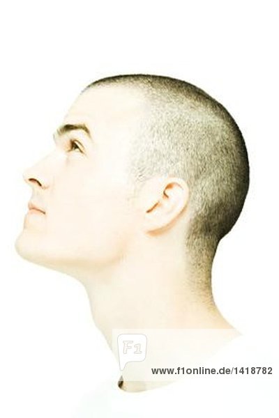 Young man's head  looking up  profile