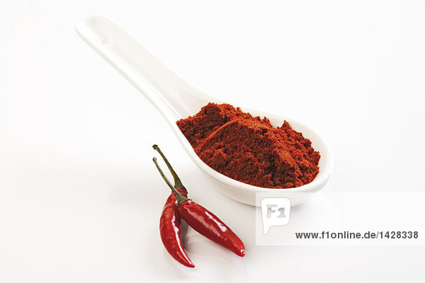 Ground cayenne pepper and red chilli pod