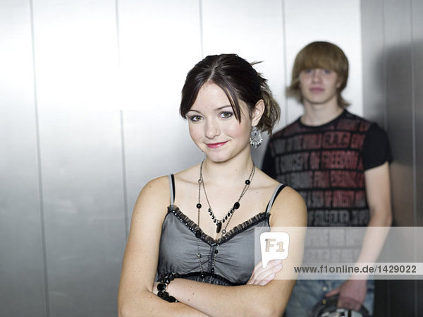 Young couple standing in lift