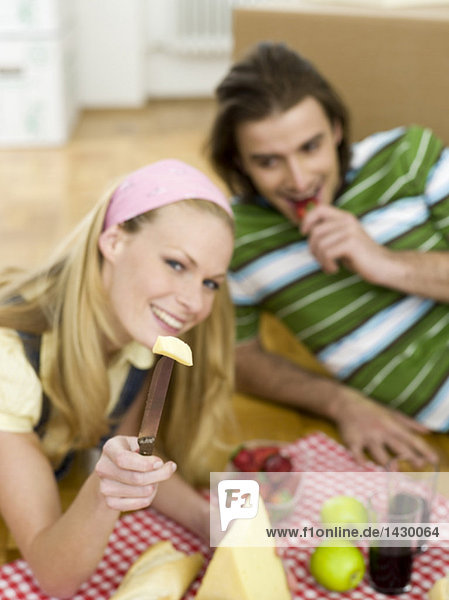 Couple having break in new flat