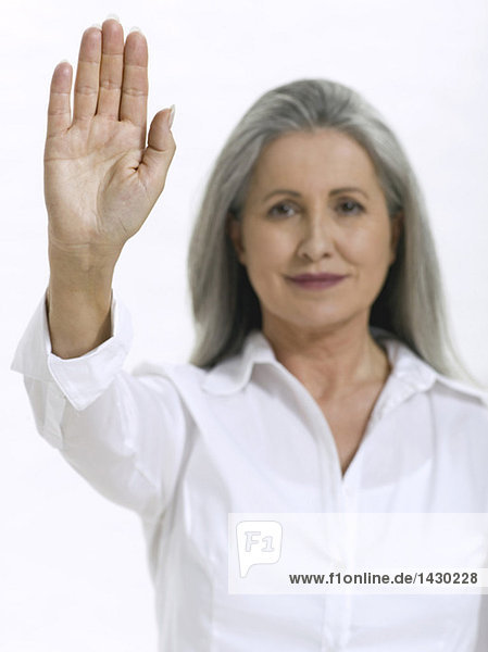 Senior woman showing palm