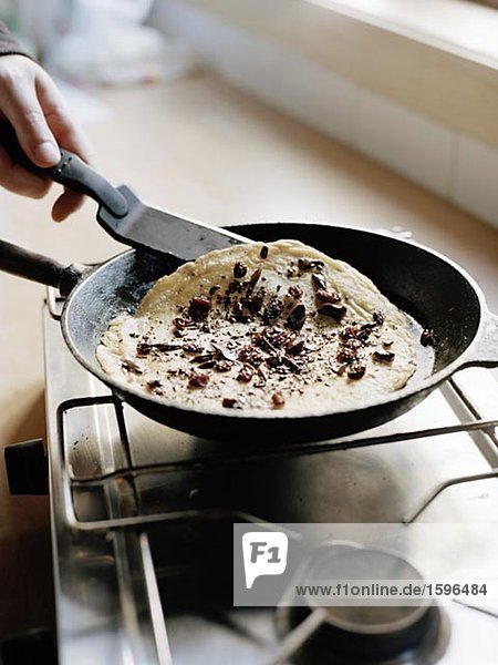 Making crepes with chocolate