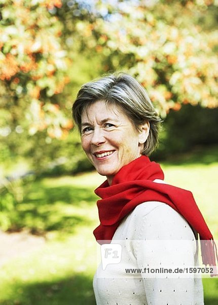 Portrait of a woman with red scarf.