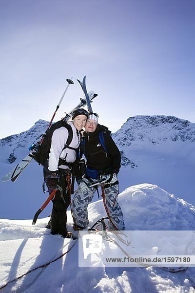 Two women on the top of a mountain.